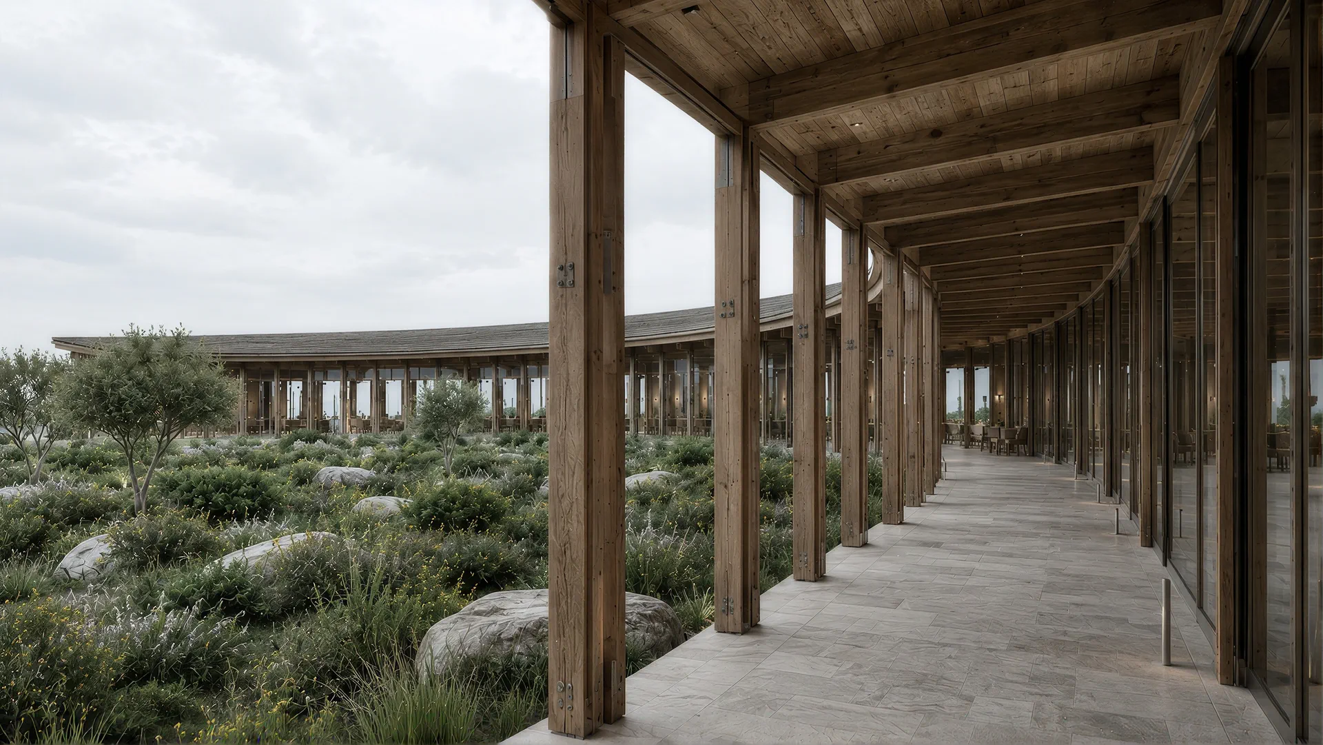 A covered timber walkway running along the glazed rooms